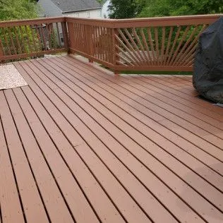 Cedar-stained deck with rail, freshly restained, clean finish