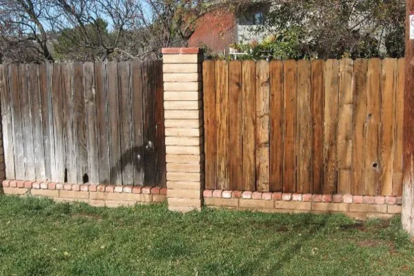 Wood fence shown half-dirty and half-clean in a single split-frame